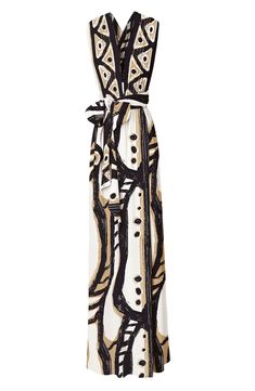 a white and black dress with an abstract design on the front, tied at the waist