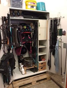 an organized closet with skis and snow gear