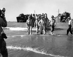 On this day in 1945, American and Filipino troops recaptured Manila as the Battle of Manila came to an end. Here, General MacArthur leads troops landing in the Philippines not quite two months earlier.  (Carl Mydans—The LIFE Picture Collection) Life Magazine Photos, Tacloban City, Douglas Macarthur, Uk Visa, Iconic Photos, Photo Essay