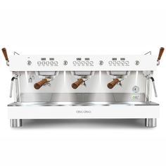 an espresso machine with three cups on it