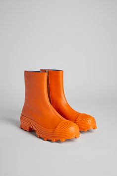 Vulcanized orange leather zip boots with toothed rubber outsoles and OrthoLite® cushioned footbeds. Colorful Boots, Camper Boots, Boots Orange, Orange Boots, Gladiator Boots, Boho Boots, Funky Shoes, Orange Shoes, Rubber Boots