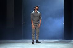 a man is standing in the middle of a stage