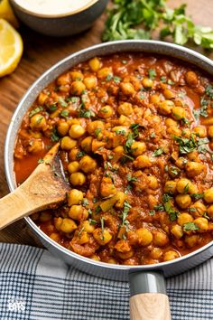 a pan filled with chickpeas and garnished with parsley