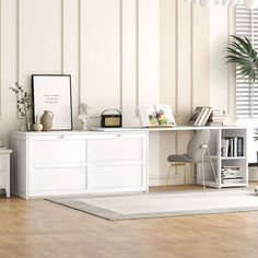 a living room with white furniture and wooden floors