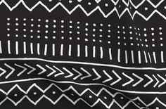 a black and white pattern is shown in this image, it appears to be painted on the fabric