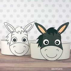 two paper cups with donkey faces on them