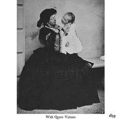 an old black and white photo of a woman holding a baby in her lap with the caption, with queen victoria