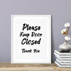 a white framed poster with the words please keep door closed, thank you on it