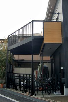 an apartment building with black iron railings and balconies