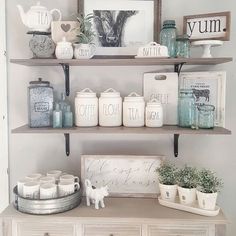 the shelves in this room are filled with jars and other things to put on them