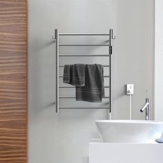 a bathroom with a sink and towel rack