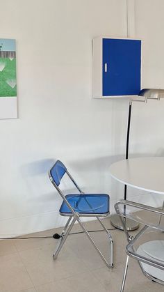 two chairs and a table in a room