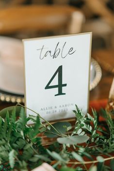 the table numbers are displayed with greenery