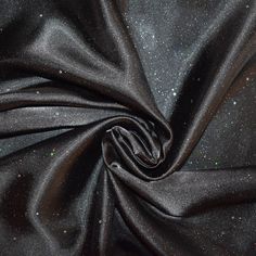 a black fabric with glitters on it