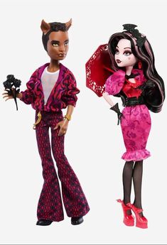 two dolls dressed up in clothes and accessories