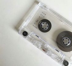 an old cassette with two black wheels on it