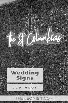 the neon sign for the st columbuss wedding signs is hanging from strings in black and white