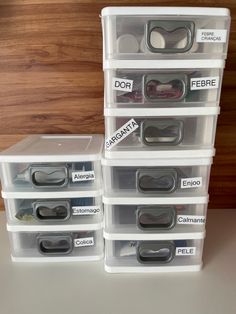 several clear plastic drawers with labels on them