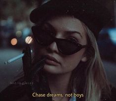 a woman wearing sunglasses and a hat with the caption chase dreams, not boys