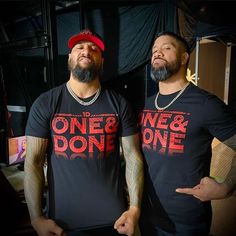 two men standing next to each other wearing t - shirts that say one and donee