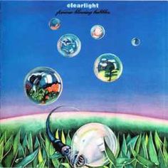 an album cover with bubbles floating in the air and a woman's head surrounded by grass