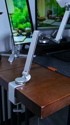 a computer desk with two monitors on it