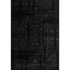 a black rug with an intricate design on the front and back side, it's dark