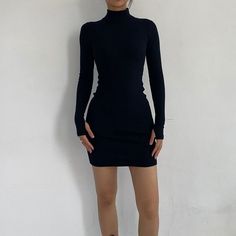 Colder days call for the casual yet cute design of the Go Beyond Basic Black Ribbed Long Sleeves Dress! Features stretchy ribbed knit shaped with a turtle neckline, fitted long sleeves, and bodycon silhouette with a mini hem. Made from polyester & spandex blend fabric Available in size S-L Model is wearing size S Long Sleeve Dress Spring, Streetwear Dresses, Black Turtleneck Dress, Dress Streetwear, Black Dress With Sleeves, Stylish Coat, Slim Dress, Black Long Sleeve Dress, Black Turtleneck
