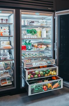 an open refrigerator filled with lots of different types of food and drinks, including fruits and vegetables