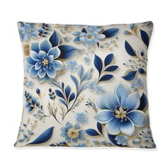 a blue and white pillow with flowers on it