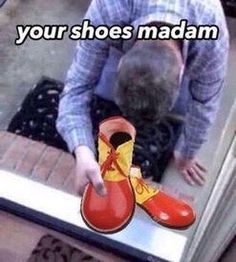 a person with their head in a pair of red and yellow shoes that say, you're your shoes madam