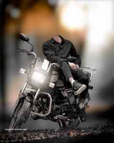 a man sitting on the back of a motorcycle