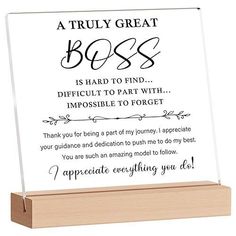 a wooden plaque with an inscription that says, a truly great boss is hard to find