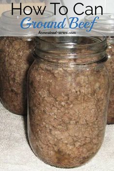 four jars filled with food sitting on top of a counter