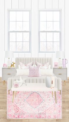 a white couch sitting next to two windows in a room with pink rugs on the floor