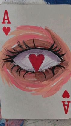 a card with an eye and hearts on it