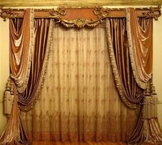 an old fashioned bed with curtains on it