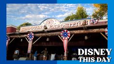 the entrance to disney's this day is decorated with red, white and blue ribbons