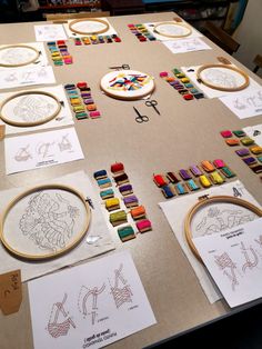 the table is covered with drawings and crayons for children to use on crafts