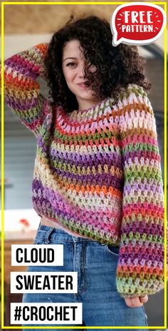 a woman with curly hair wearing a multicolored crochet sweater and jeans