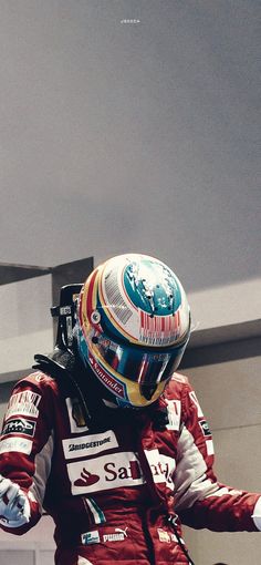 a man in a racing suit and helmet