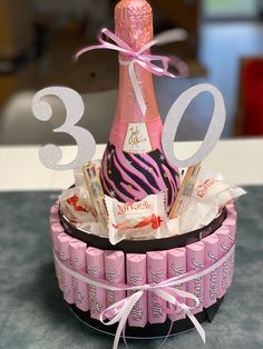 a birthday cake made to look like a wine bottle with chocolates and candy in it