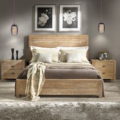 a bedroom with two framed pictures above the bed