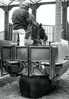 a man riding on the back of a horse