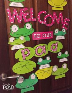 a door decorated with frogs and the words welcome to our pad