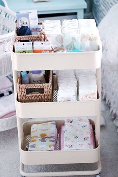 a baby changing table with diapers and blankets on it's shelves next to a crib