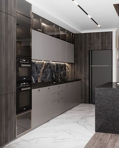 a modern kitchen with marble counter tops and stainless steel appliances