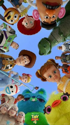 the poster for toy story 4 is shown in front of a blue sky with many cartoon characters