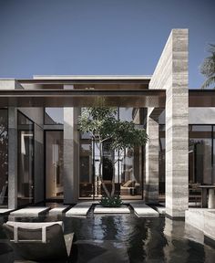 a modern house with an outdoor pool and seating area