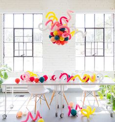 an image of a table with balloons on it and the words chandelier above it